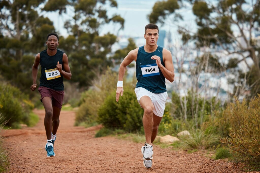 Marathon, race and people running in nature for fitness competition or sports challenge. Runner or